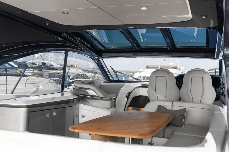 V50330 Yacht Photos Pics Luxurious interior of 2024 Princess V50 Open yacht with modern seating and sleek design.