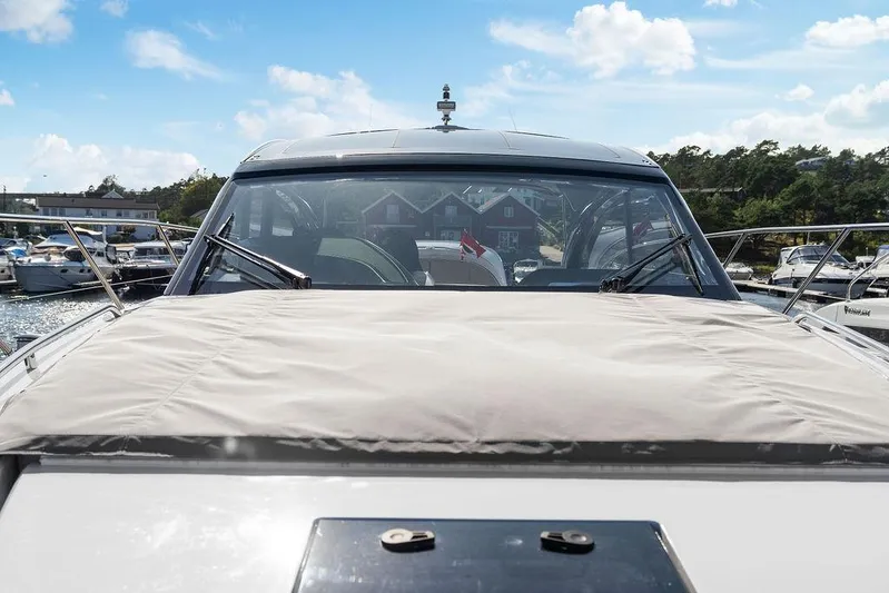 V50330 Yacht Photos Pics 2024 Princess V50 Open yacht docked at marina, clear sky, and scenic background.