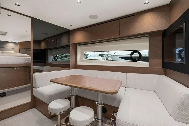 V50330 Yacht Photos Pics Luxurious interior of 2024 Princess V50 Open yacht with modern seating and dining area.