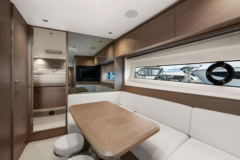 V50330 Yacht Photos Pics Luxurious interior of 2024 Princess V50 Open yacht with modern furnishings and large windows.