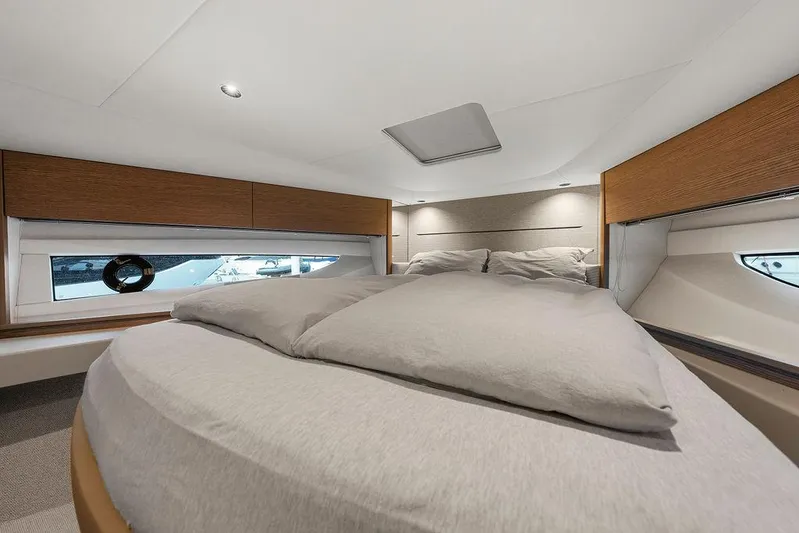 V50330 Yacht Photos Pics Luxurious cabin interior of 2024 Princess V50 Open yacht with cozy bedding.