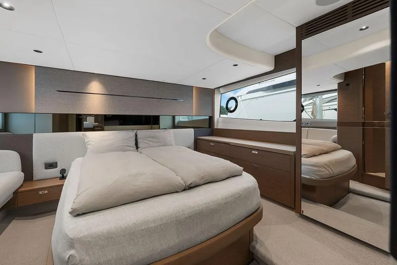 V50330 Yacht Photos Pics Luxurious bedroom interior of 2024 Princess V50 Open yacht, featuring modern design and elegant furnishings.