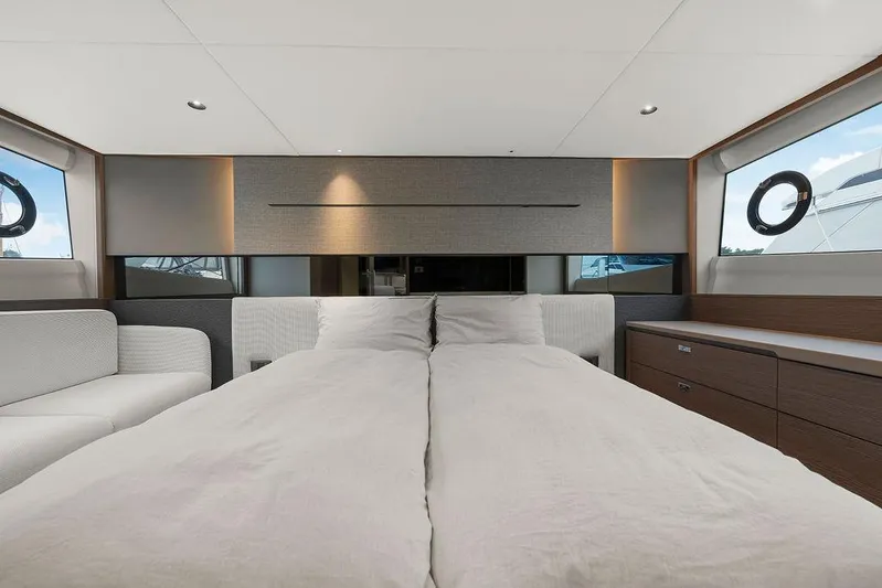 V50330 Yacht Photos Pics Luxurious bedroom interior of 2024 Princess V50 Open yacht, featuring modern design and elegant furnishings.