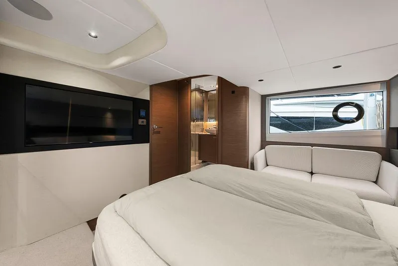 V50330 Yacht Photos Pics Luxurious interior of 2024 Princess V50 Open yacht with modern furnishings and large window.