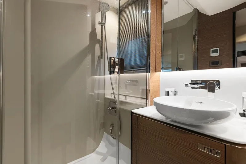 V50330 Yacht Photos Pics Luxurious bathroom in 2024 Princess V50 Open yacht with modern fixtures and elegant design.