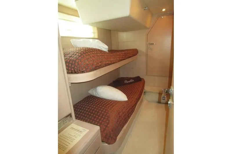Tivella Yacht Photos Pics Cozy cabin with bunk beds in 2009 VZ 68 FLY yacht interior.