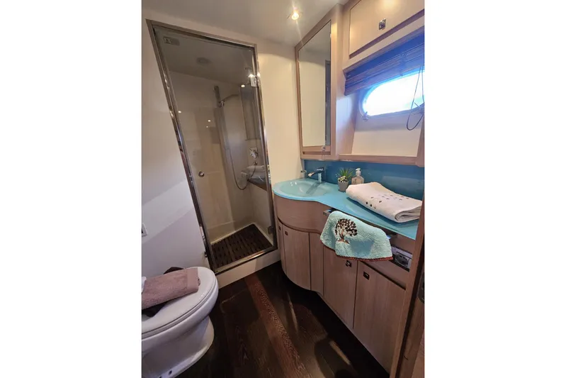 Tivella Yacht Photos Pics Luxurious bathroom in 2009 VZ 68 FLY yacht with modern fixtures and elegant design.
