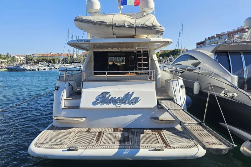 Tivella Yacht Photos Pics Luxury yacht VZ 68 FLY 2009 docked in a marina, rear view.