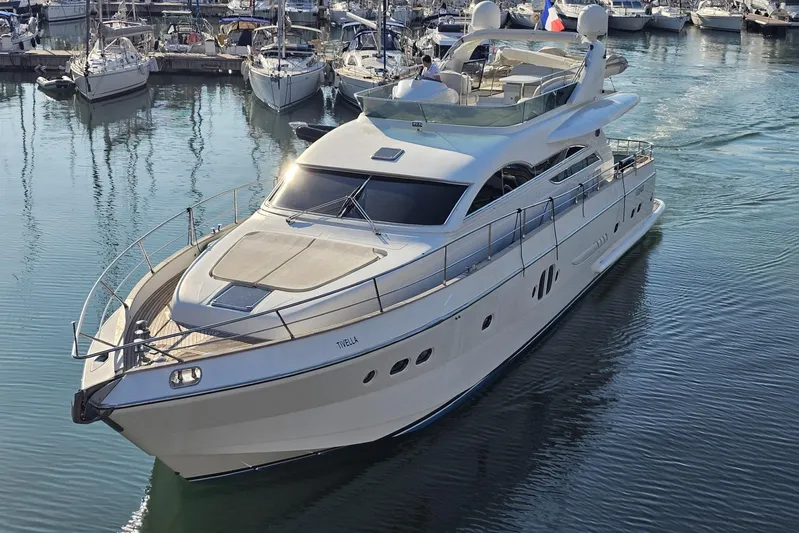Tivella Yacht Photos Pics Luxury VZ 68 FLY yacht from 2009 cruising in a marina.