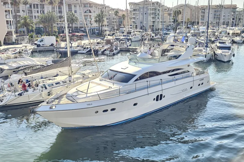 Tivella Yacht Photos Pics Luxury VZ 68 FLY yacht from 2009 docked in a marina with surrounding boats.