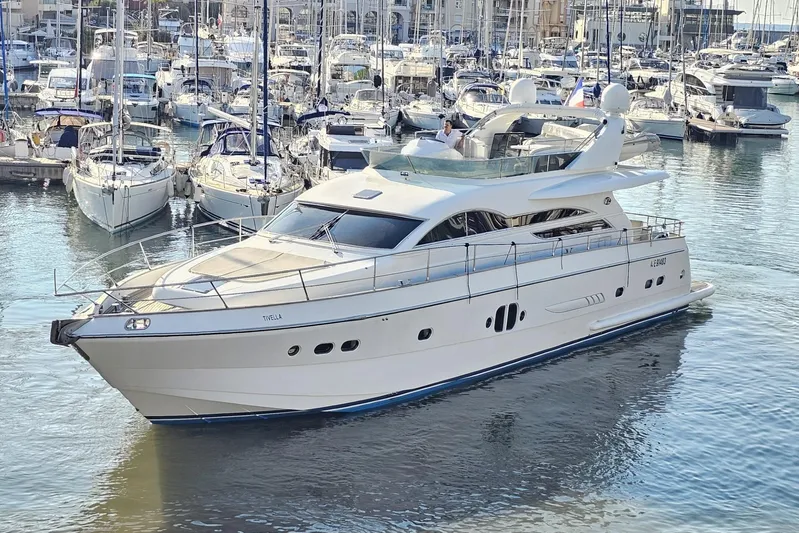 Tivella Yacht Photos Pics Luxurious 2009 VZ 68 FLY yacht docked in a bustling marina.