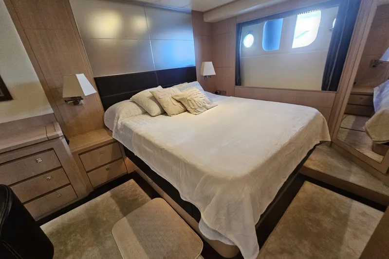 Tivella Yacht Photos Pics Luxurious bedroom interior of 2009 VZ 68 FLY yacht with elegant furnishings and soft lighting.