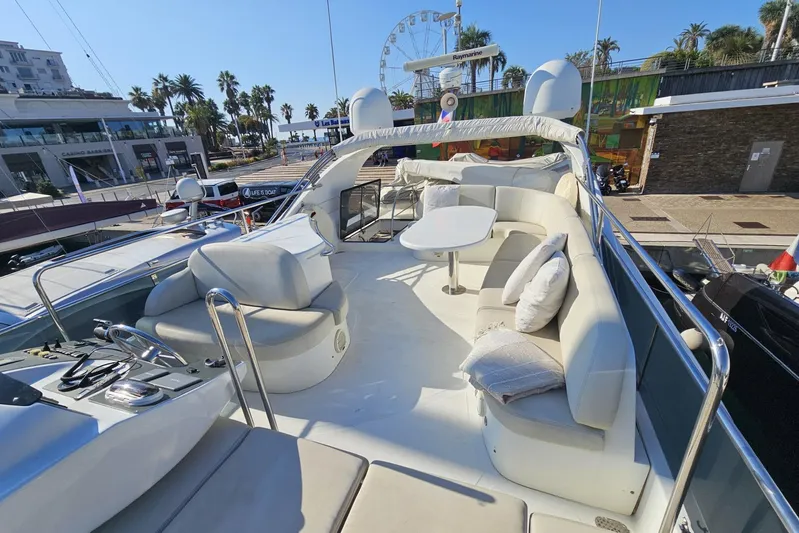 Tivella Yacht Photos Pics Luxurious 2009 VZ 68 FLY yacht with spacious deck and elegant seating area.