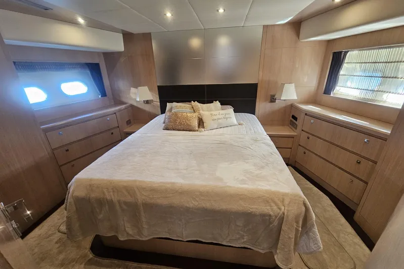 Tivella Yacht Photos Pics Luxurious bedroom interior of 2009 VZ 68 FLY yacht with elegant wood finish.