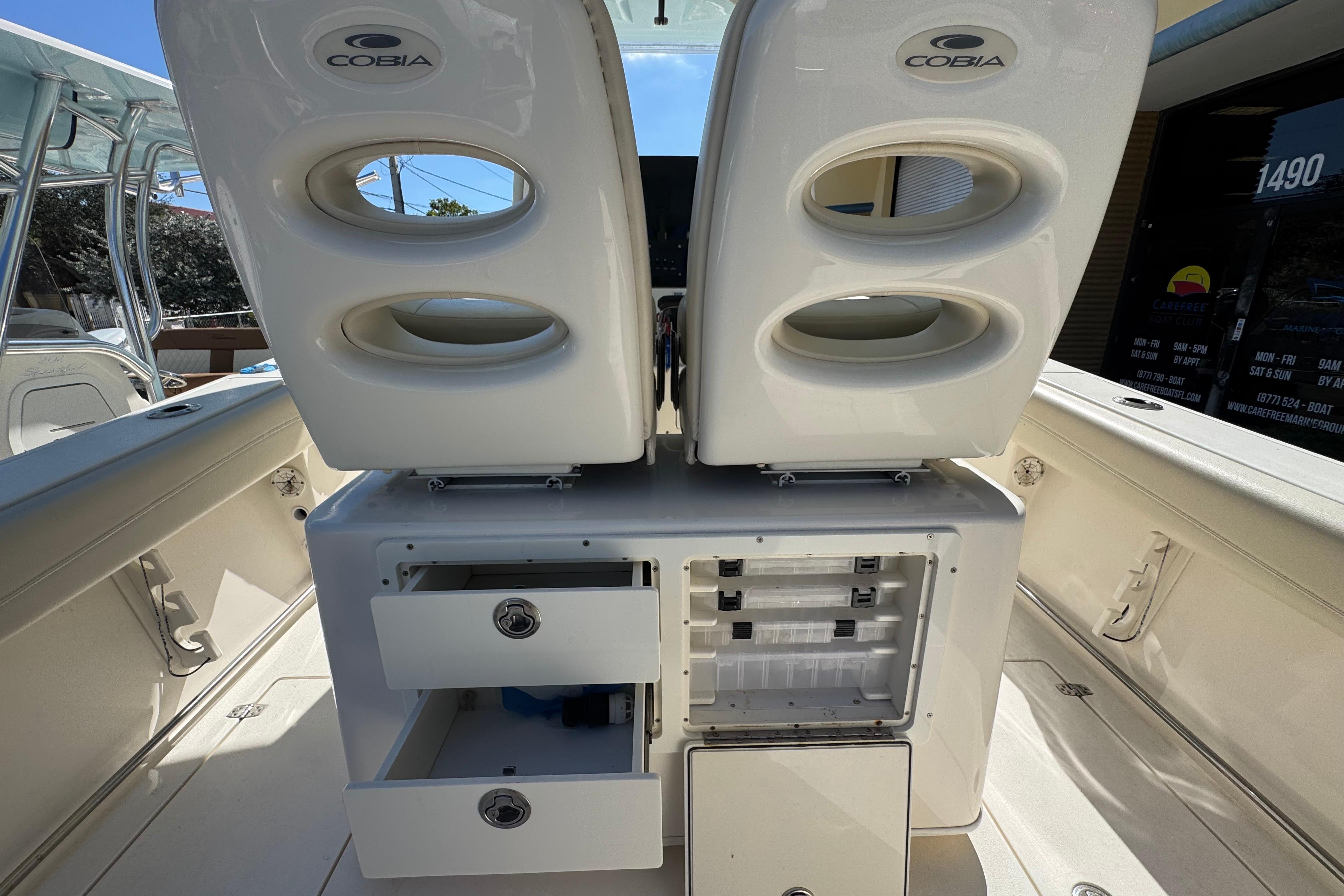 2021 Cobia 262 Center Console boat interior with storage compartments and seating.