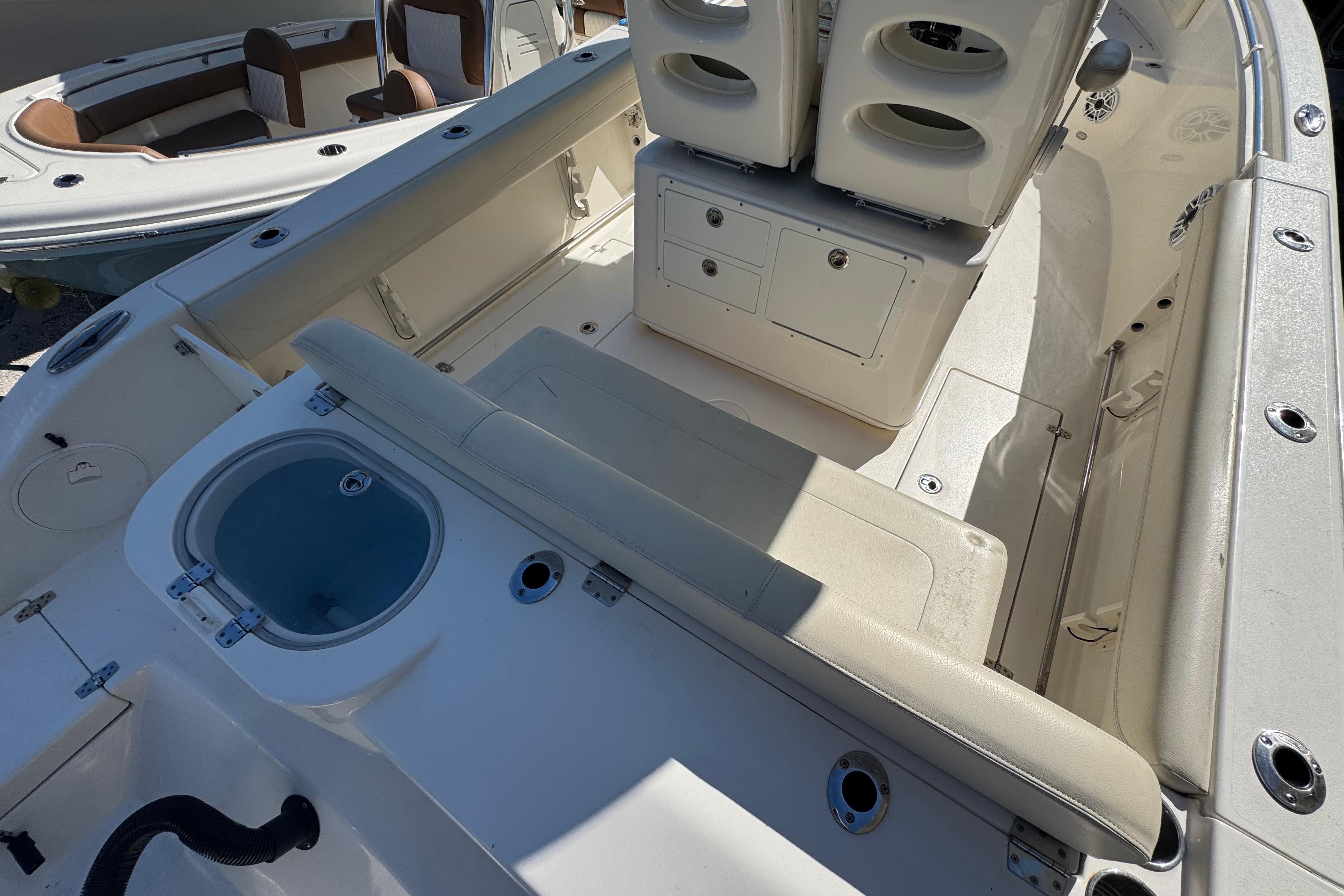 2021 Cobia 262 Center Console boat interior with seating and storage compartments.