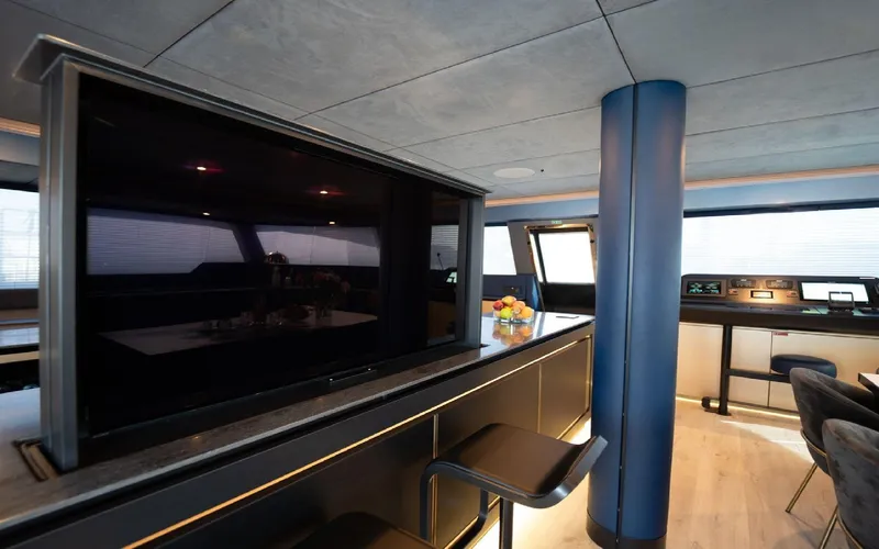 Catallaxi Yacht Photos Pics Luxurious interior of 2024 Sunreef 60 Sail yacht with modern design and sleek furnishings.