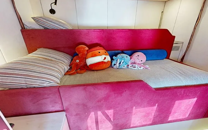 Catallaxi Yacht Photos Pics Cozy cabin bed with plush toys on 2024 Sunreef 60 Sail yacht.