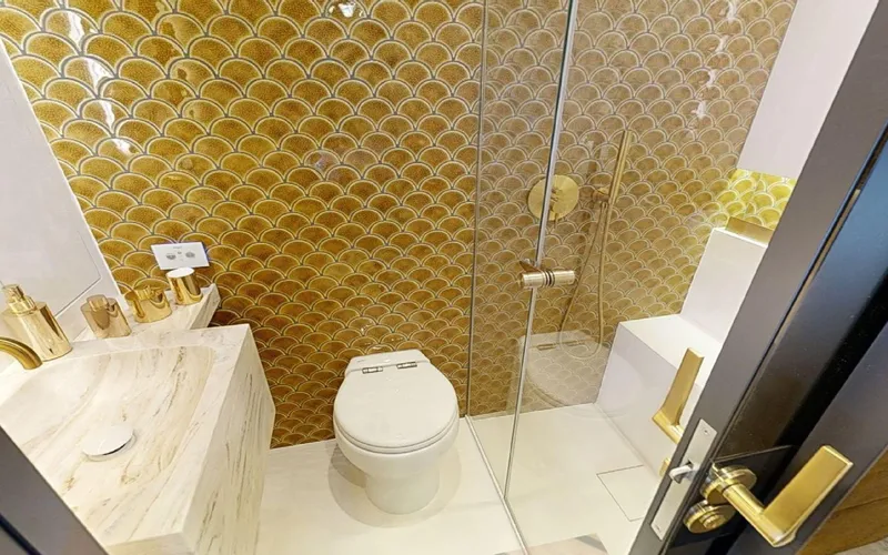 Catallaxi Yacht Photos Pics Luxurious bathroom with gold accents in 2024 Sunreef 60 Sail yacht.