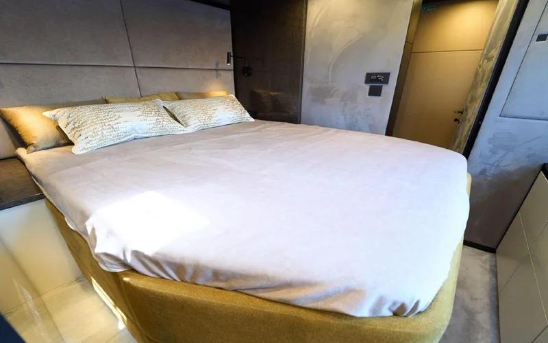 Catallaxi Yacht Photos Pics Luxurious bedroom interior of 2024 Sunreef 60 Sail yacht with modern design.