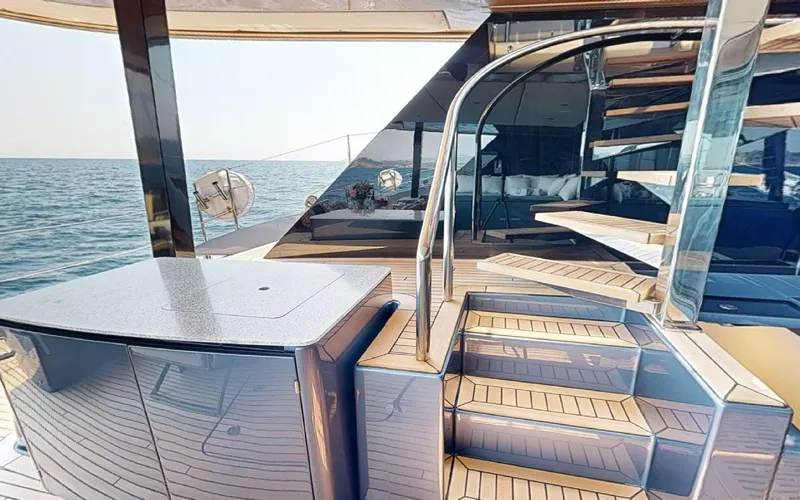 Catallaxi Yacht Photos Pics Luxurious Sunreef 60 Sail yacht deck with elegant spiral staircase, 2024 model.