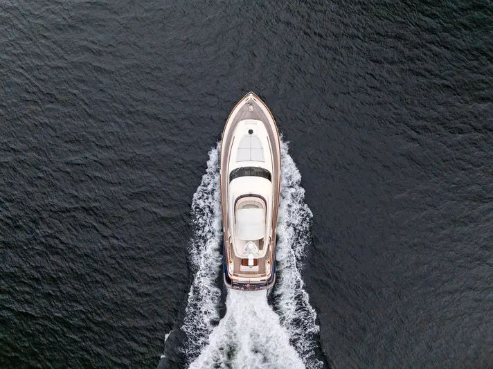 Cetacea Yacht Photos Pics Aerial view of 2008 Mochi Craft Dolphin yacht cruising on open water.