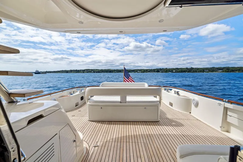 Cetacea Yacht Photos Pics 2008 Mochi Craft Dolphin yacht deck with ocean view and American flag.