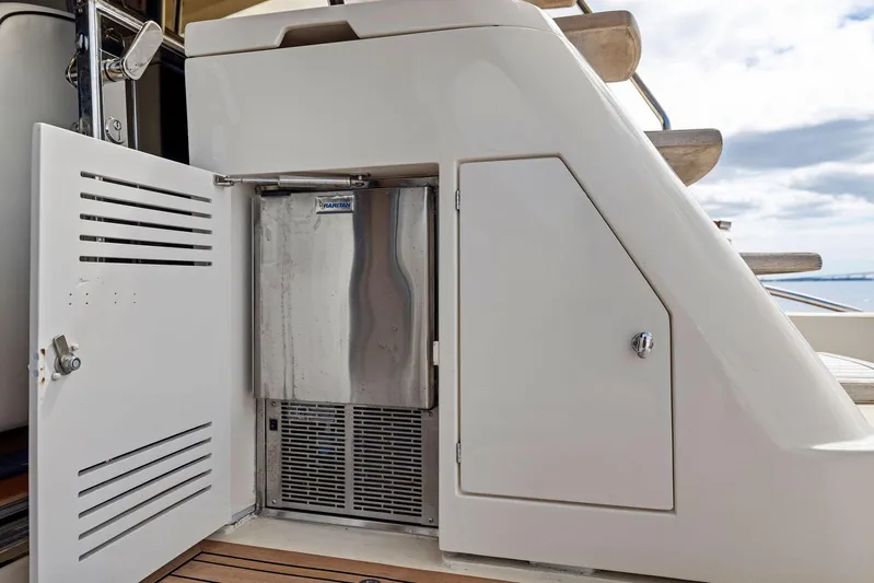 Cetacea Yacht Photos Pics 2008 Mochi Craft Dolphin yacht with open storage compartment and stainless steel appliance.