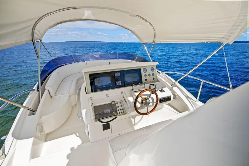 Cetacea Yacht Photos Pics 2008 Mochi Craft Dolphin yacht helm with ocean view and navigation equipment.