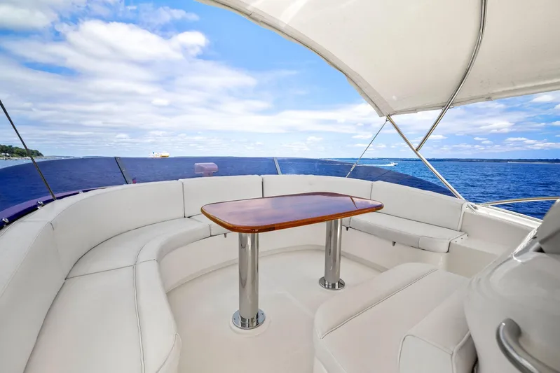 Cetacea Yacht Photos Pics Luxurious 2008 Mochi Craft Dolphin yacht with elegant seating and ocean view.