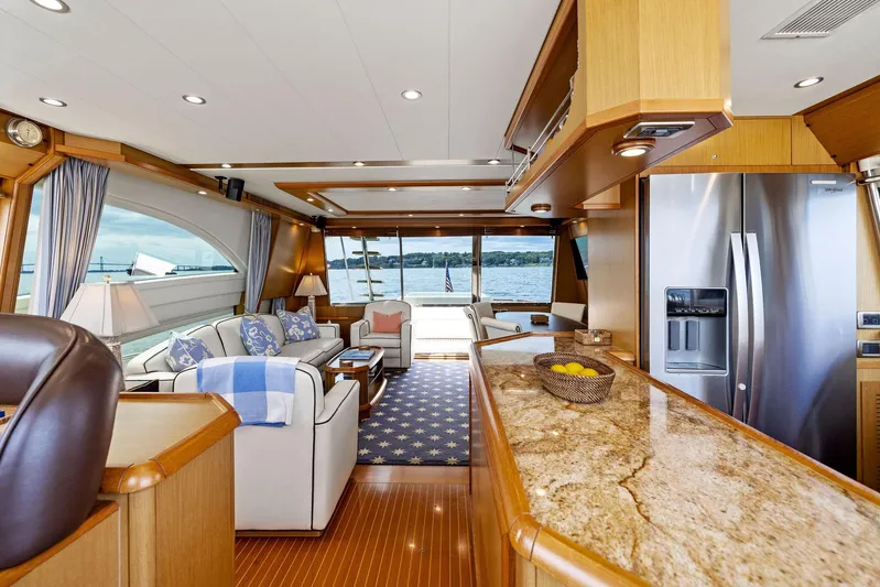 Cetacea Yacht Photos Pics Luxurious 2008 Mochi Craft Dolphin yacht interior with elegant furnishings and panoramic windows.