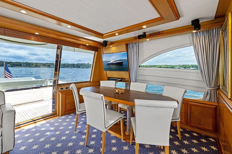 Cetacea Yacht Photos Pics Luxurious 2008 Mochi Craft Dolphin yacht interior with elegant dining area and scenic water views.