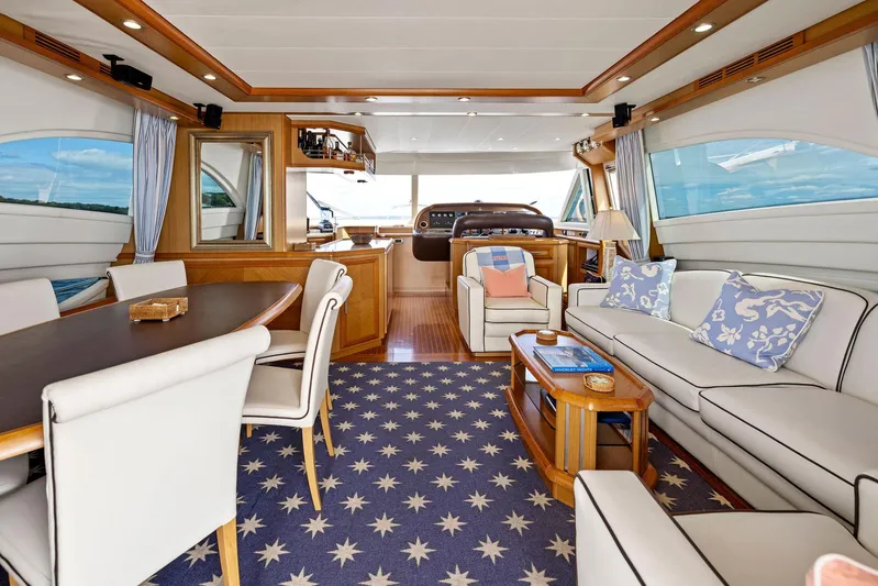Cetacea Yacht Photos Pics Luxurious 2008 Mochi Craft Dolphin yacht interior with elegant seating and nautical decor.