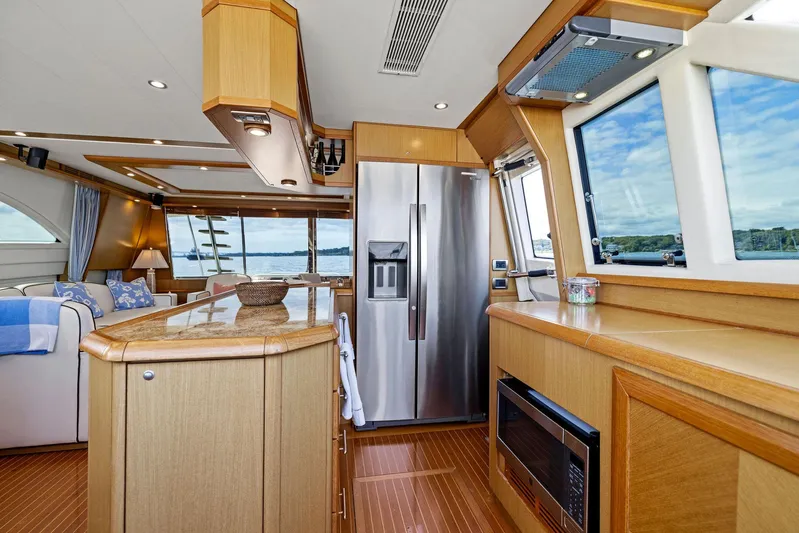 Cetacea Yacht Photos Pics Luxurious 2008 Mochi Craft Dolphin yacht interior with modern kitchen and scenic windows.
