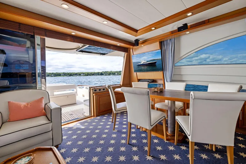 Cetacea Yacht Photos Pics Luxurious 2008 Mochi Craft Dolphin yacht interior with elegant dining area and scenic ocean view.