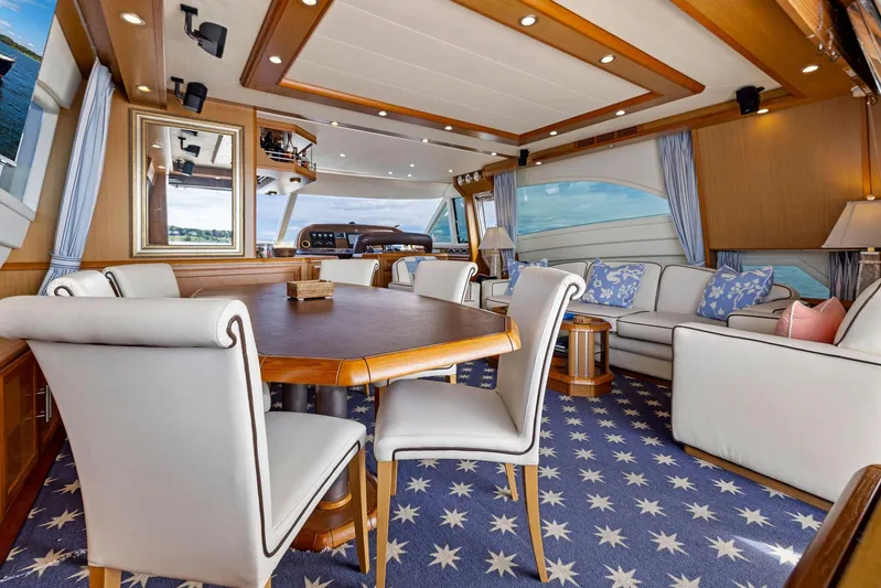 Cetacea Yacht Photos Pics Luxurious 2008 Mochi Craft Dolphin yacht interior with elegant dining and seating area.