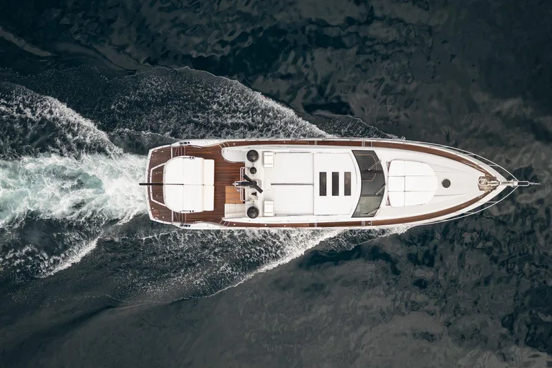M/y Titan Yacht Photos Pics Aerial view of 2011 Sunseeker Predator 74 yacht cruising on open water.