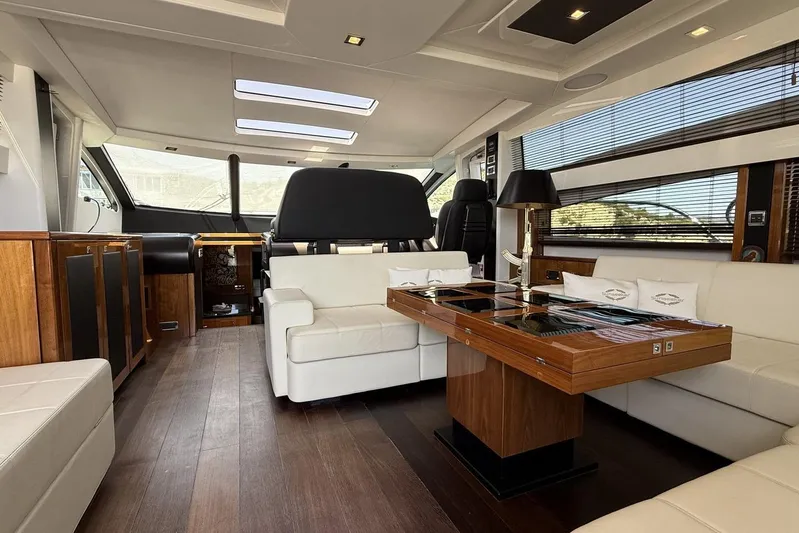 M/y Titan Yacht Photos Pics Luxurious interior of 2011 Sunseeker Predator 74 yacht with elegant seating and wooden accents.