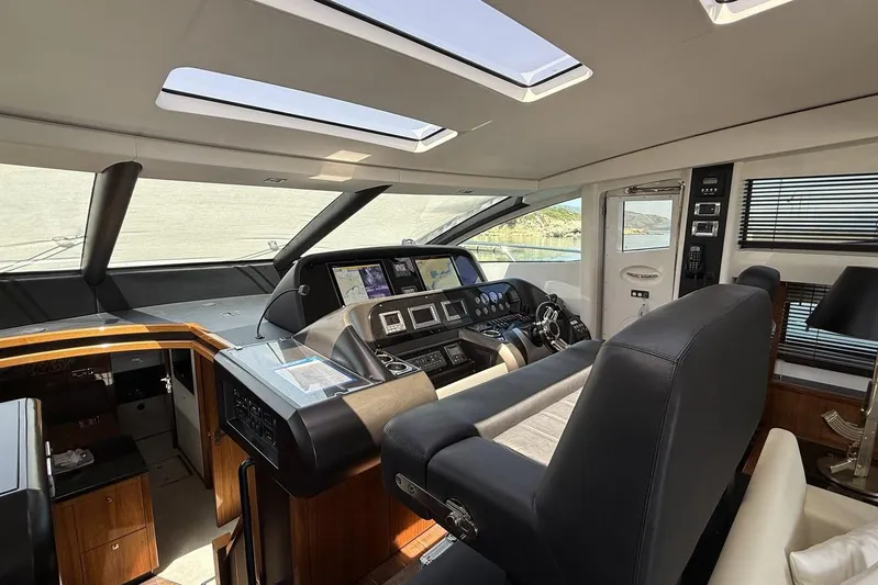 M/y Titan Yacht Photos Pics Interior helm of 2011 Sunseeker Predator 74 yacht, featuring modern navigation equipment.
