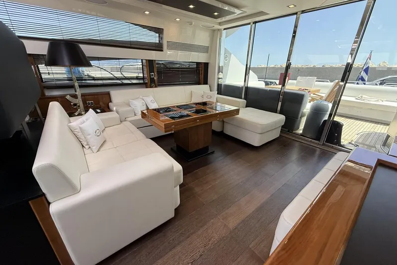 M/y Titan Yacht Photos Pics Luxurious interior of 2011 Sunseeker Predator 74 yacht with elegant white seating.