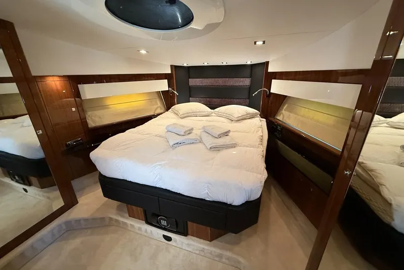 M/y Titan Yacht Photos Pics Luxurious bedroom interior of 2011 Sunseeker Predator 74 yacht with elegant bedding.