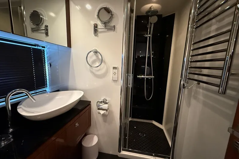 M/y Titan Yacht Photos Pics Luxurious bathroom in 2011 Sunseeker Predator 74 yacht with modern fixtures and shower.