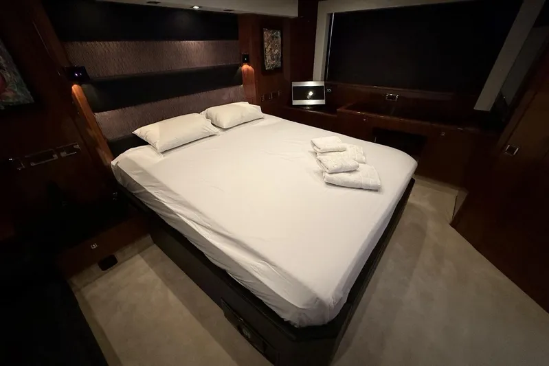M/y Titan Yacht Photos Pics Luxurious bedroom interior of 2011 Sunseeker Predator 74 yacht with elegant bedding.