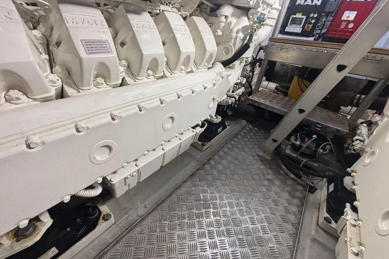 M/y Titan Yacht Photos Pics Engine room of a 2011 Sunseeker Predator 74 yacht, showcasing machinery and equipment.