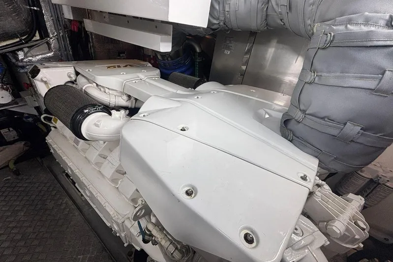 M/y Titan Yacht Photos Pics Engine room of a 2011 Sunseeker Predator 74 yacht, showcasing a powerful engine.