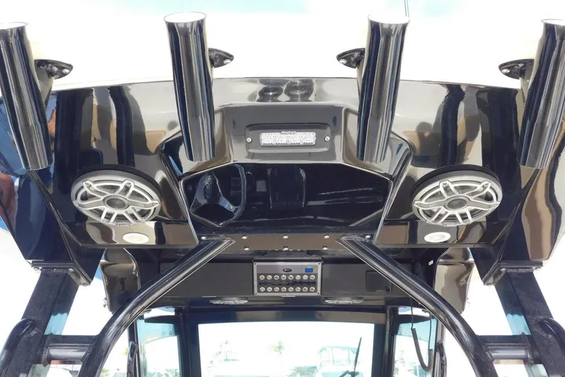  Yacht Photos Pics 2024 Scout 330 LXF boat interior with speakers and rod holders.