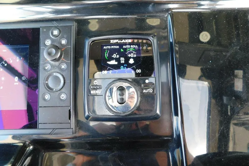  Yacht Photos Pics Control panel of 2024 Scout 330 LXF boat with Zipwake auto pitch and roll system.