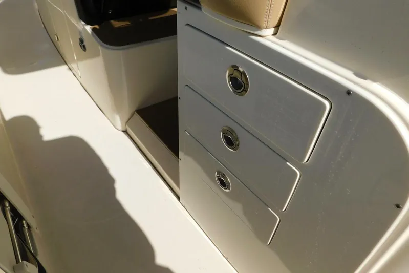  Yacht Photos Pics 2024 Scout 330 LXF boat interior with storage drawers and seating.