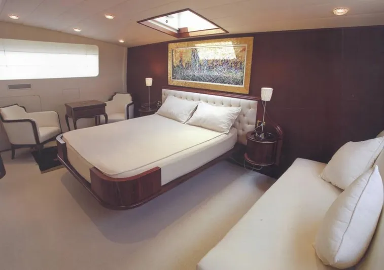  Yacht Photos Pics Luxurious bedroom interior on 2001 Castagnola 30 mt yacht, featuring elegant furnishings and decor.