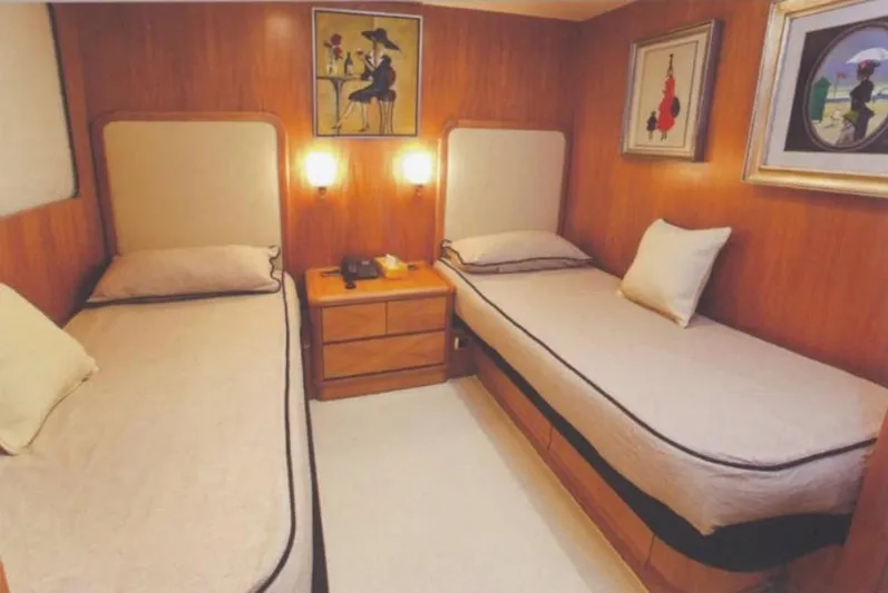  Yacht Photos Pics Twin cabin interior of 2001 Castagnola 30 mt yacht, featuring elegant wood paneling.